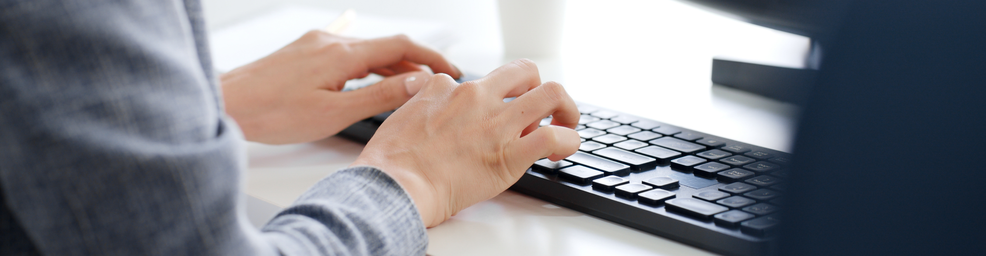 Closeup business people hands typing on keyboard computer desktop for using internet