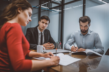 couple and mediator at desk