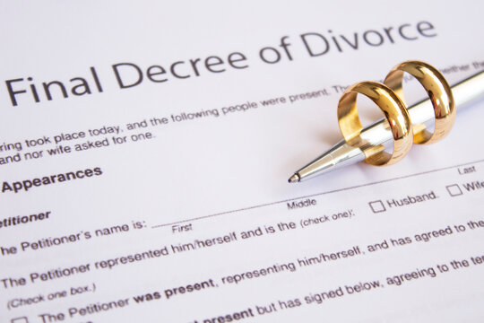 final divorce decree with pen and rings