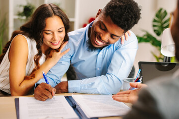 couple happily signing postnuptial agreement