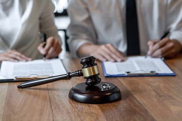 couple with gavel and rings