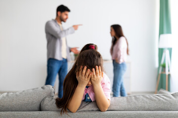 sad child and parents